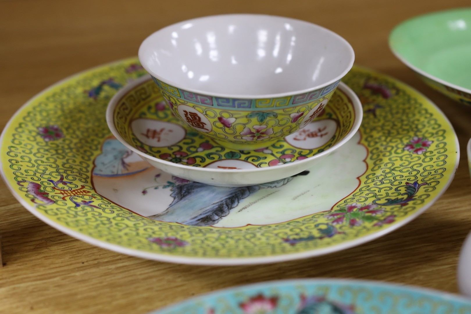 A group of Chinese enamelled porcelain plates, dishes, covers, cups and a vase